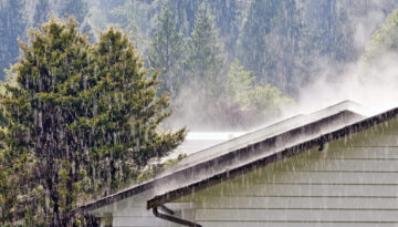 Rain falling on a house in the Rogue Valley