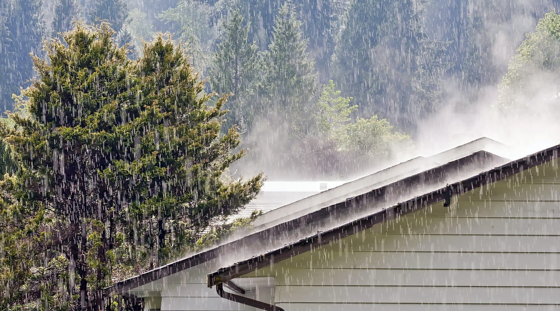 Rain falling on a house in the Rogue Valley