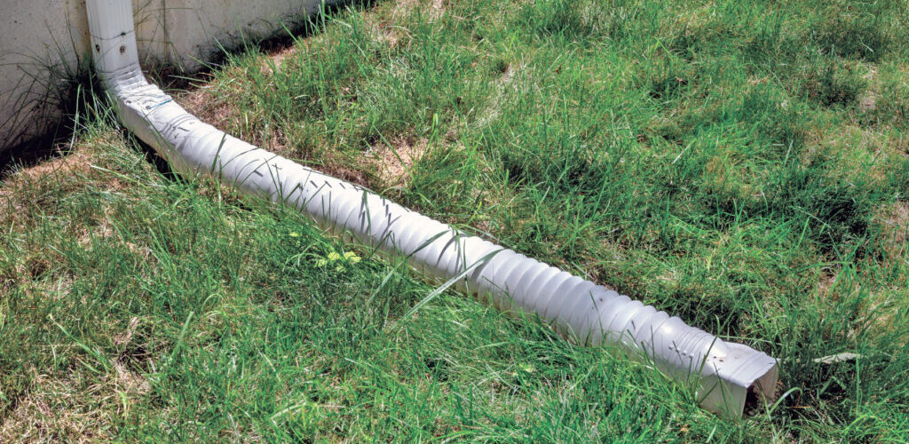 A downspout extension moving water away from house