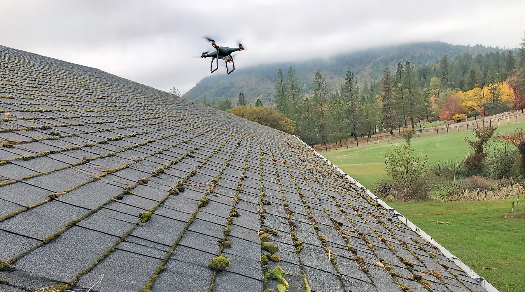 A drone inspecting roof moss in Southern Oregon