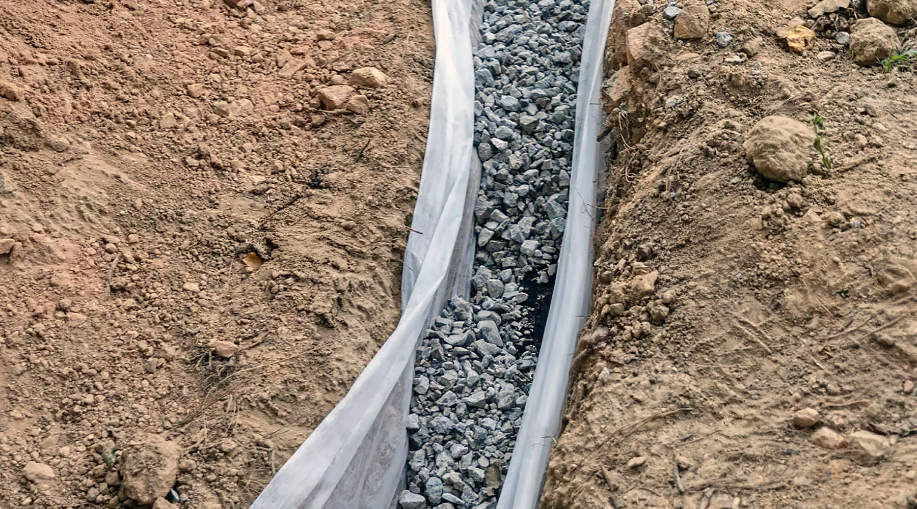 A French Drain in clay soil in Southern Oregon