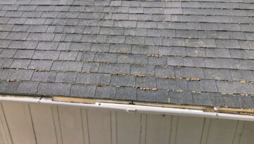 A rain gutter on a Southern Oregon house that needs repaired