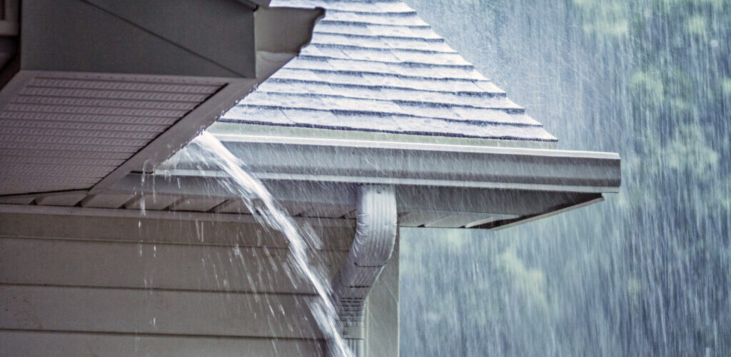An overflowing gutter on a home in Southern Oregon