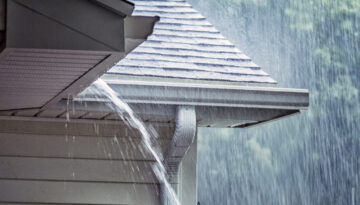 An overflowing gutter on a home in Southern Oregon