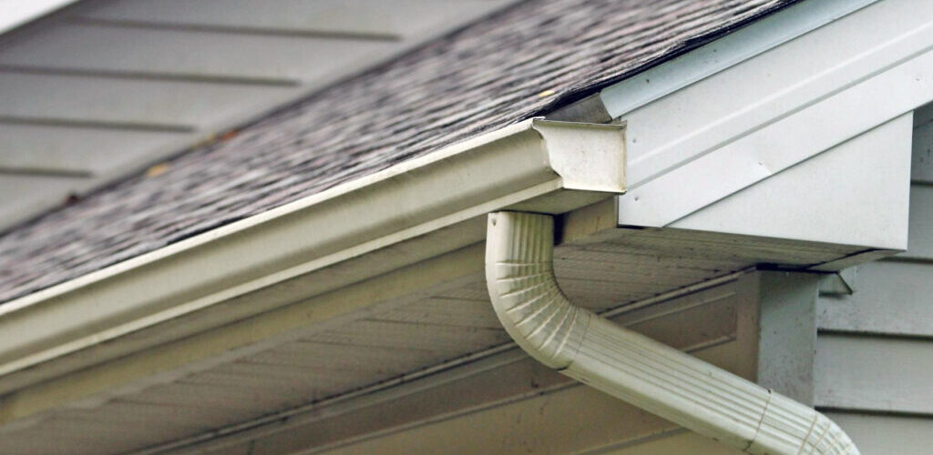 A roof with a gutter over the soffit and properly installed gutters preventing stains and drips
